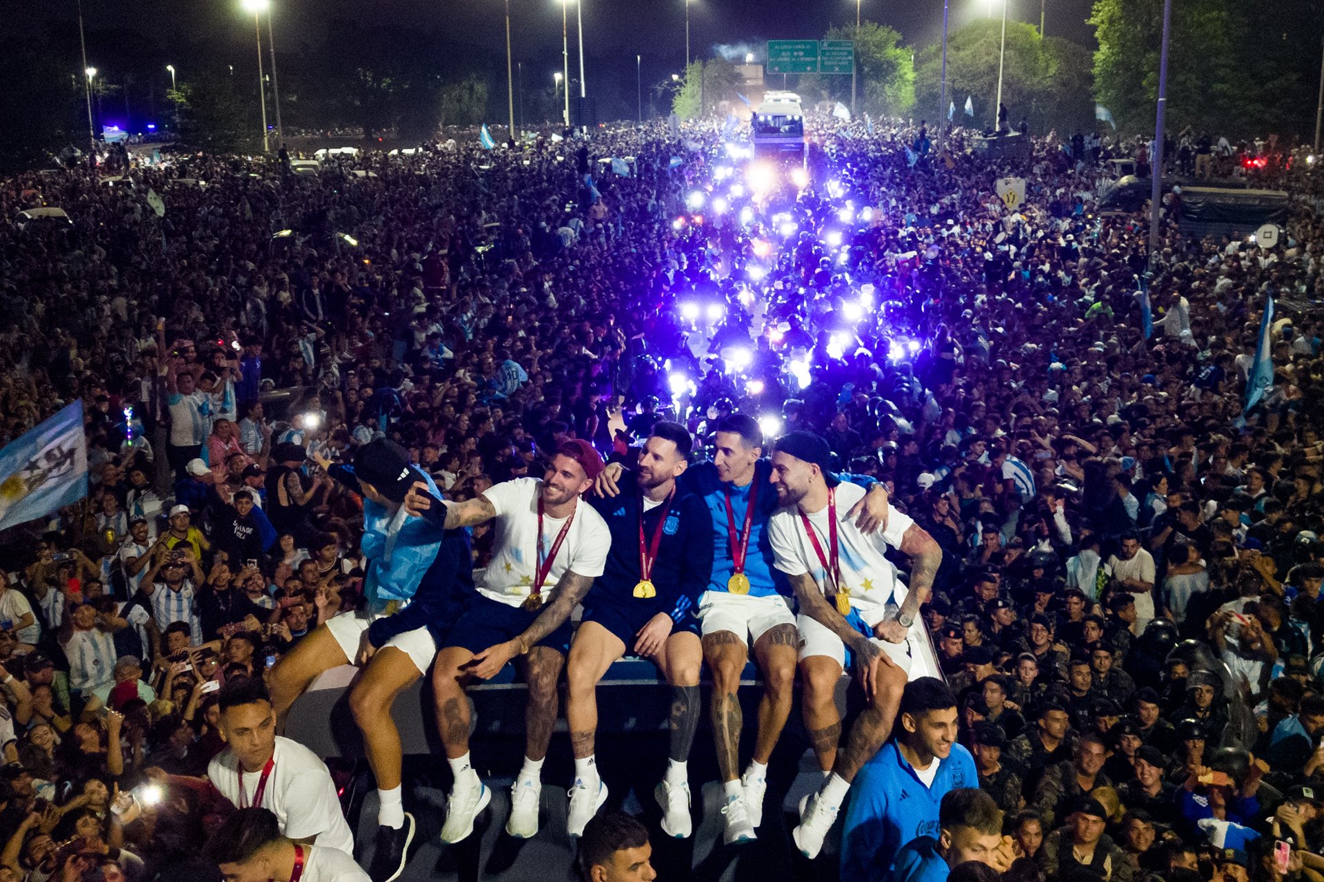 Argentina&rsquo;s captain and forward Lionel Messi takes a selfie with teammates on board the team bus during the victory parade in Buenos Aires, Argentina.