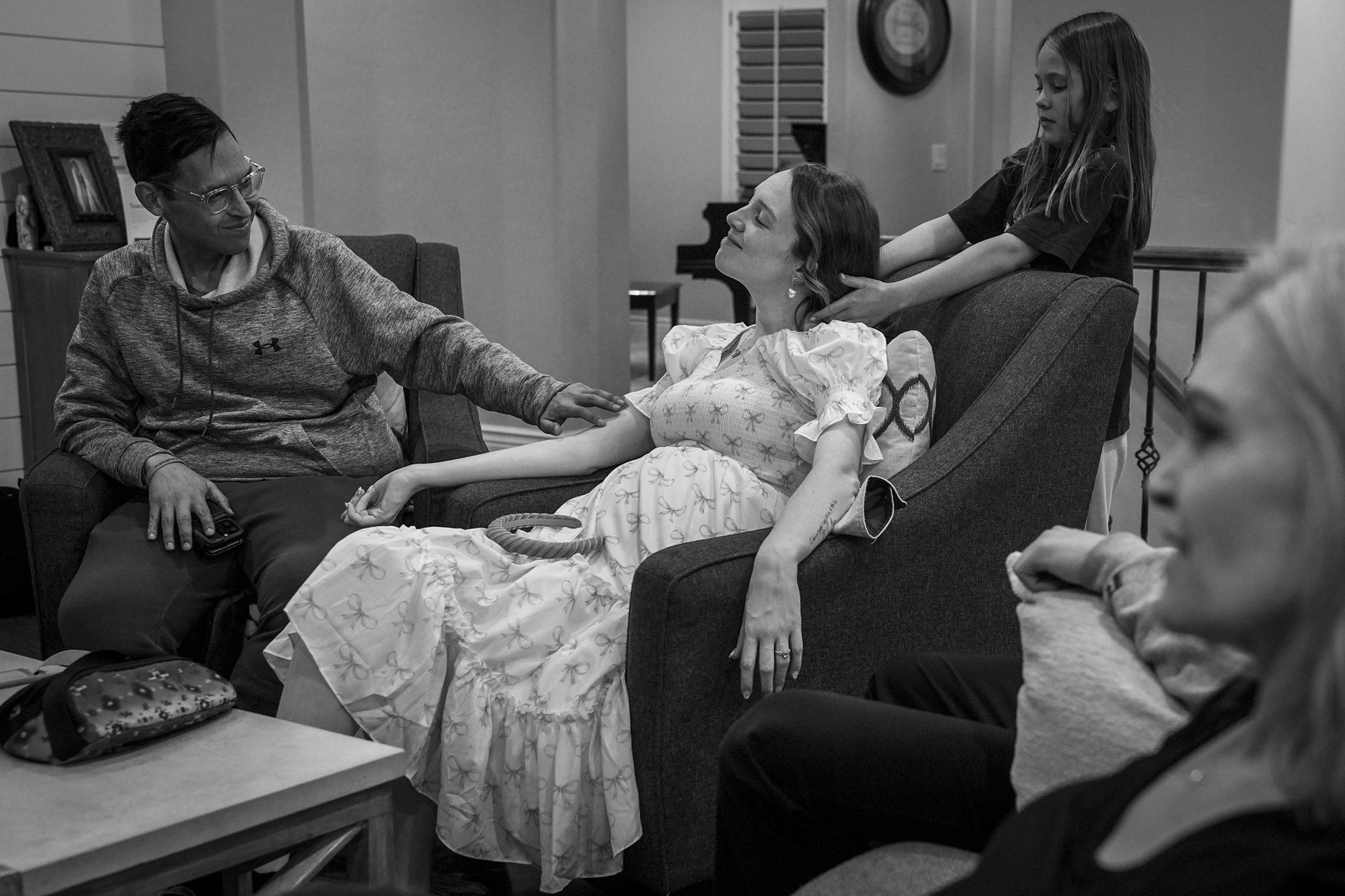 <p>Tanner strokes Shay&rsquo;s arm as her cousin plays with her hair. Between 2010 and 2019, approximately 200,000 people aged 15 to 49 were diagnosed with cancer annually in the US. South Jordan, Utah, United States</p>
