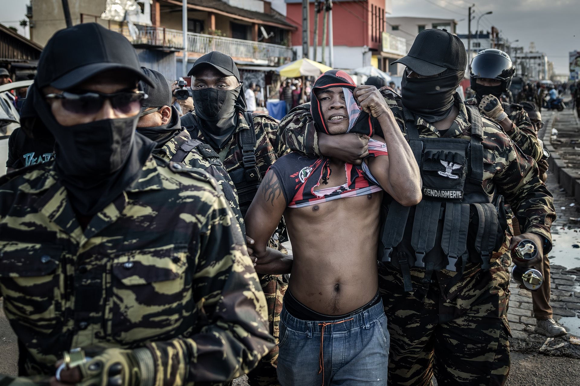 Members of the Malagasy Gendarmerie restrain a protester arrested during ongoing clashes with demonstrators in Antananarivo, Madagascar.<br />
&nbsp;