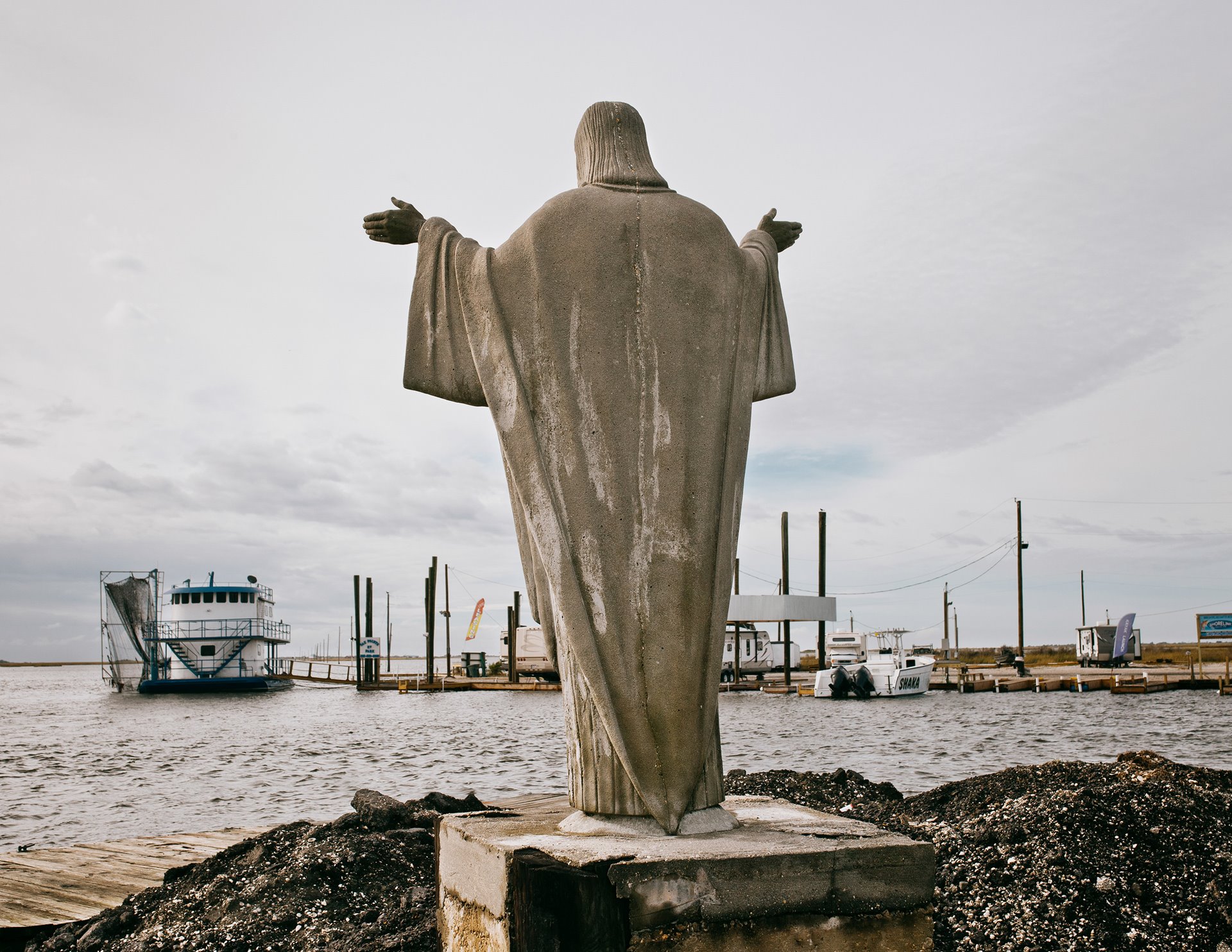 The marina at Pointe-aux-Chênes, Louisiana, United States, is the point on the mainland that is closest to Isle de Jean-Charles.