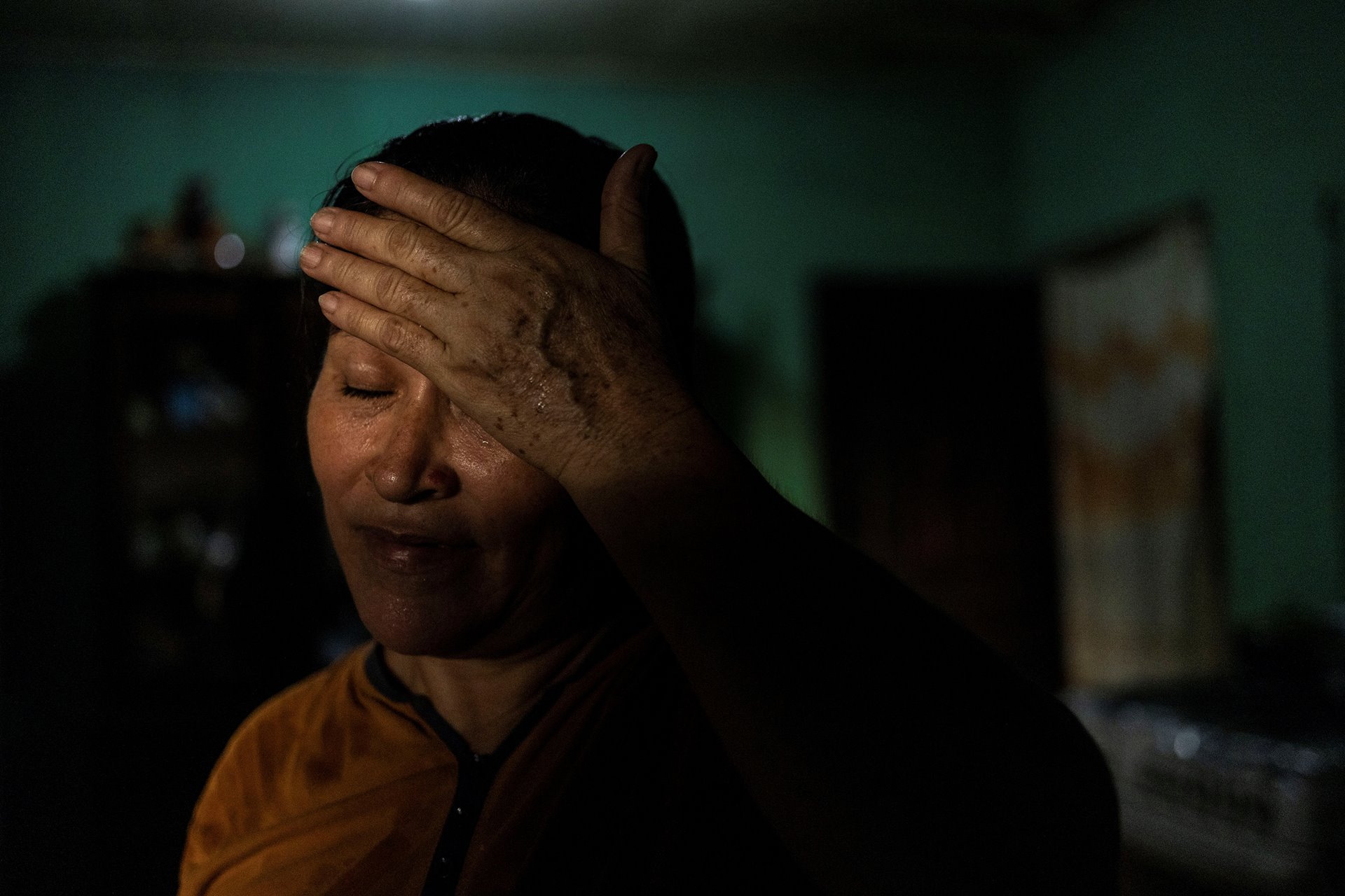 Maria Hernandez is seen at home, in San Pedro Sula, Honduras, while awaiting a decision on her immigration case, in order to travel to the United States to reunite with her daughters.