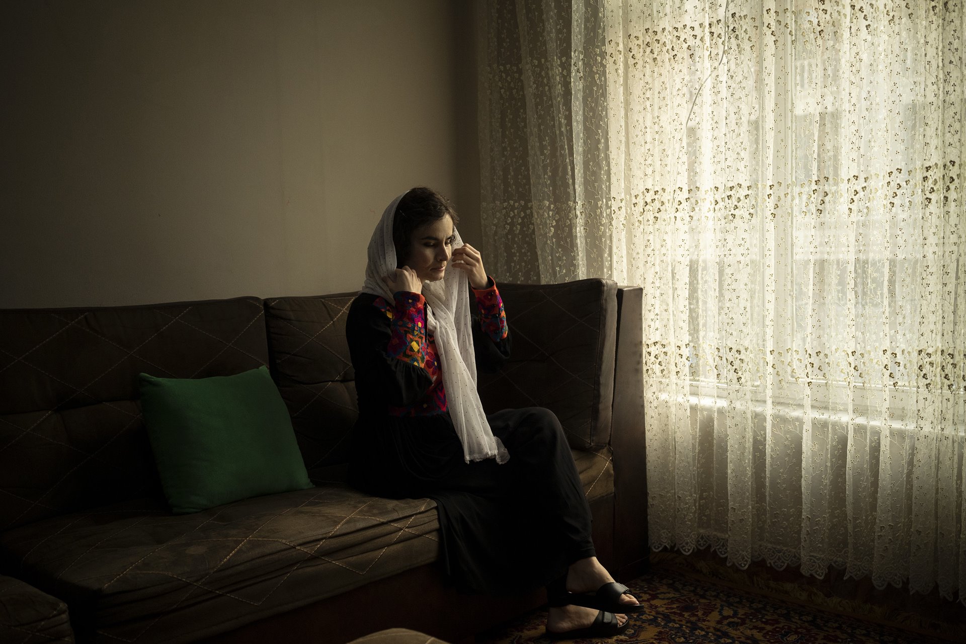 <p>Asita Ferdous, director of the government-owned Ariana Cinema in Kabul, Afghanistan, sits at home, nearly three months after the Taliban ordered female government employees to stay away from their workplaces.</p>
