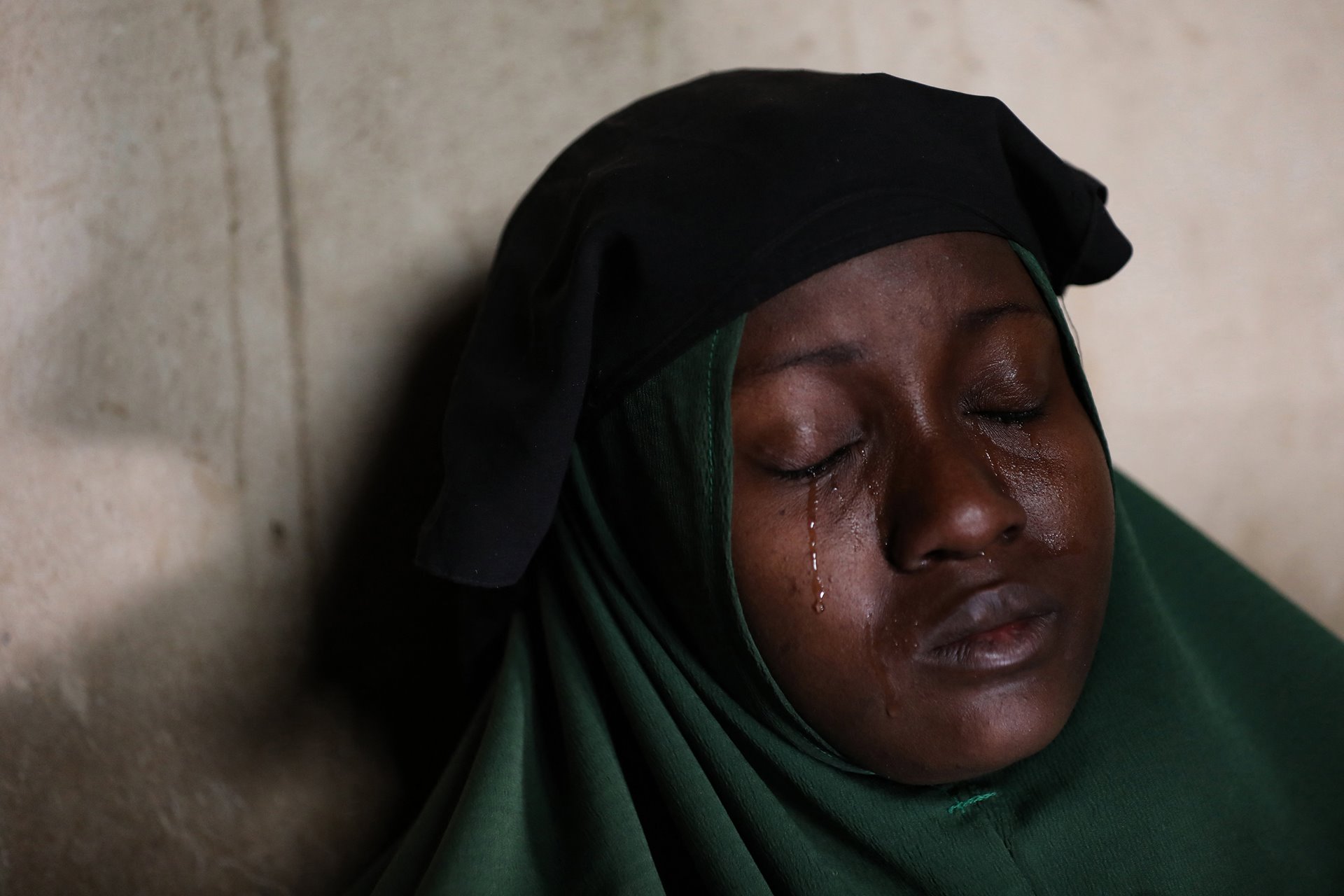 <p>Aminah Labaran (not her real name) cries at home, in Jangebe, Zamfara State, northwest Nigeria, the day after her two daughters were abducted. Gunmen, apparently from a bandit group, snatched 279 girls from dormitories in the middle of the night, at the Government Girls Secondary School in the village.</p>
