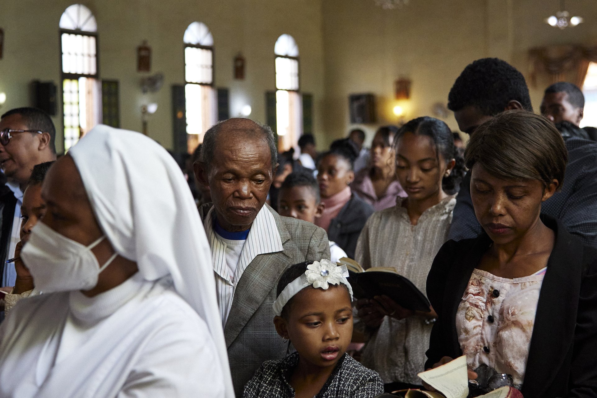 Dada Paul, Odliatemix, and Fara sing during Sunday morning worship at the Roman Catholic Church in Mandrosoa Ivato, Antananarivo, Madagascar. Their faith is important to them.&nbsp;