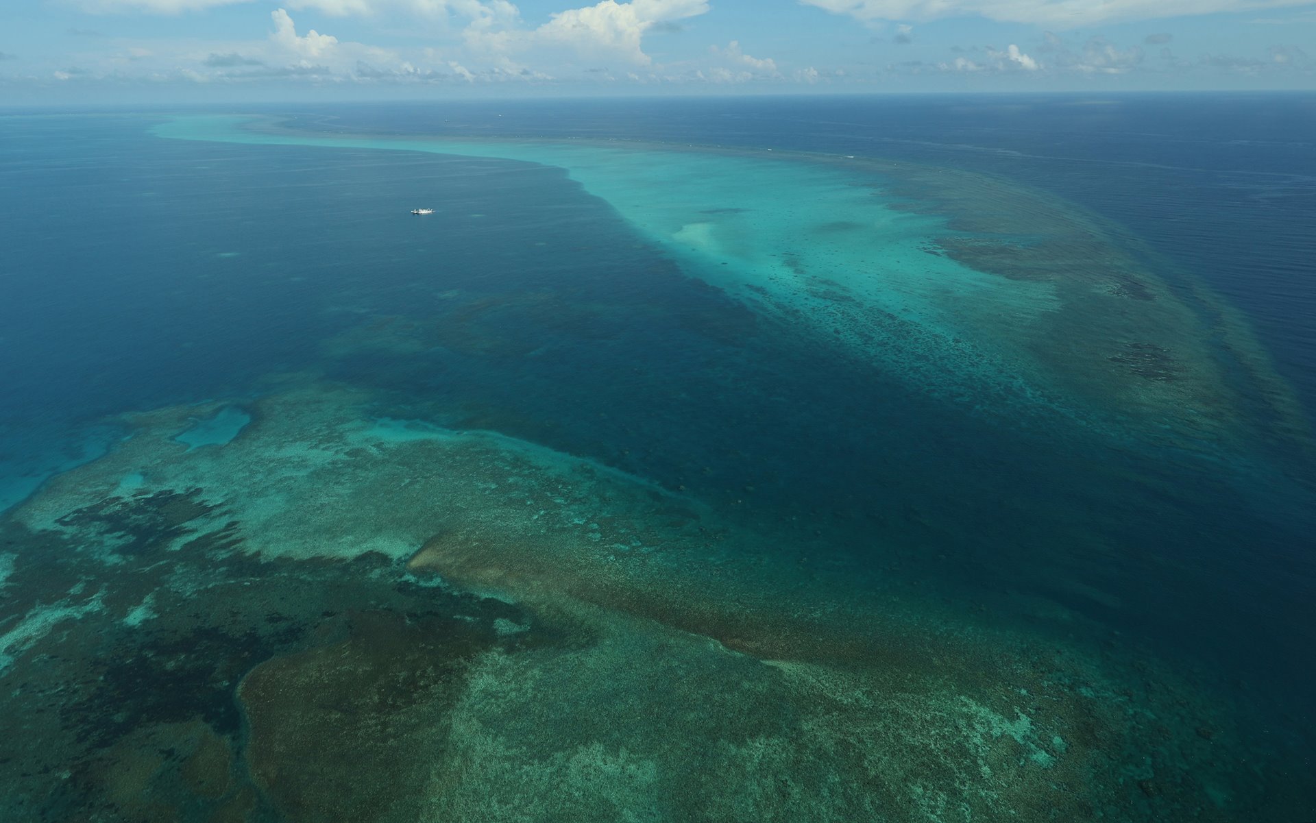 A Chinese Coast Guard vessel guards the entrance of Scarborough Shoal, off Zambales province, Philippines, as seen during the aerial surveillance by the Philippine Bureau of Fisheries and Aquatic Resources (BFAR).