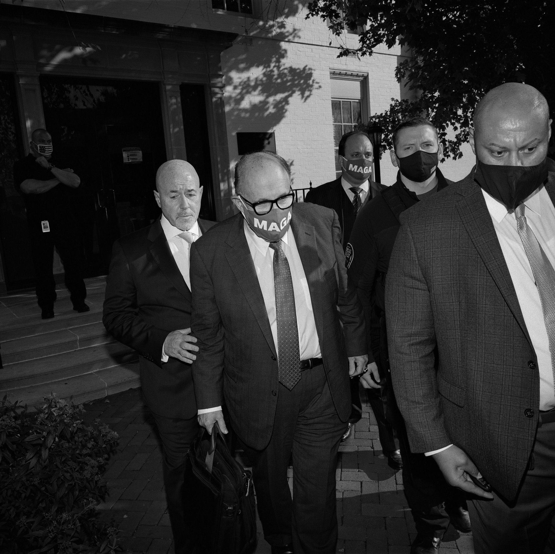 Rudy Giuliani, the president&rsquo;s personal lawyer, and his security detail leave a news conference at the Republican National Committee headquarters. The former mayor of New York City was one of the key players in Trump&rsquo;s attempts to challenge the election.